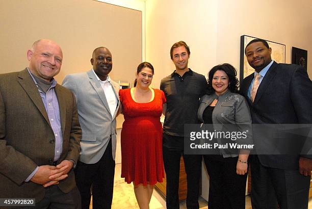 Detroit Red Wings defensemen Kyle Quincey poses with Greening of Detroit members Dean Hay, Lionel Bradford, Rebecca Salminen Witt, Monica Tabares and...