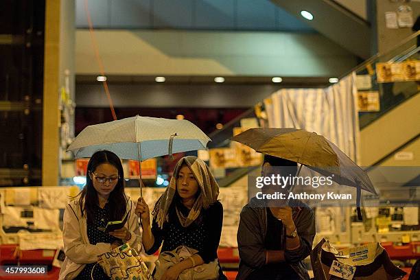 Pro-democracy protesters hold umbrellas in the air outside of Hong Kong Government Complex on October 28, 2014 in Hong Kong. Pro-democracy activists...
