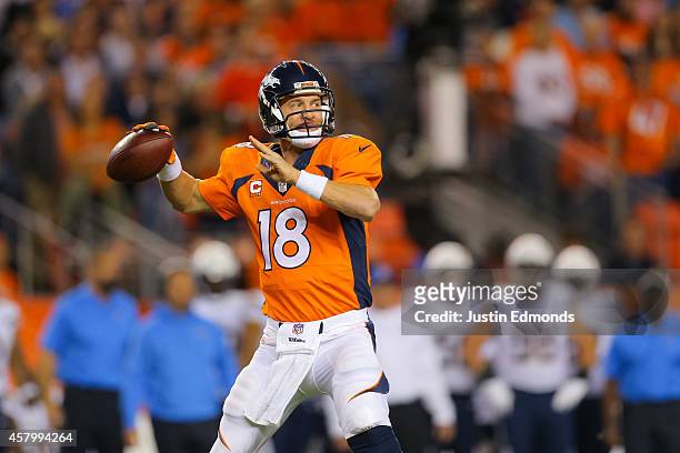 Quarterback Peyton Manning of the Denver Broncos looks to pass against the San Diego Chargers at Sports Authority Field at Mile High on October 23,...