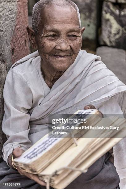 devotee nun soothsayer, telling fortunes at preah khan temple, angkor, cambodia - buddist nun stock pictures, royalty-free photos & images