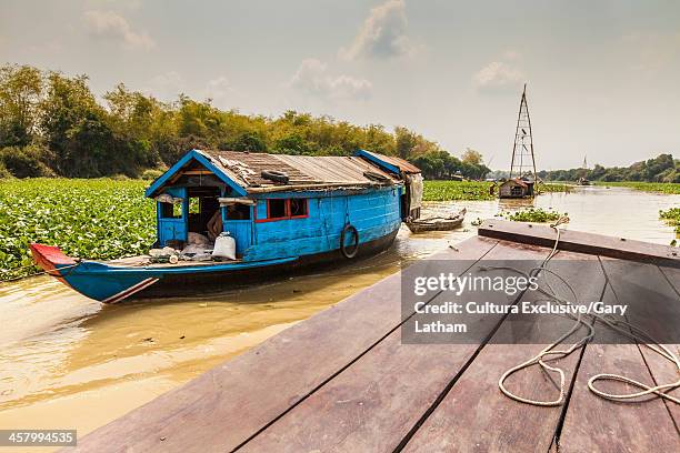 boat trip from siem reap to battambang along the sangkae river. local river traffic and fishing rigs typical of the area, sangkae river, tonle sap lake, cambodia - tonle sap stock pictures, royalty-free photos & images