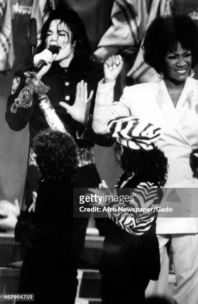 Michael Jackson receives an award at the 25th annual NAACP Image Awards with Patti LaBelle, Pasadena, California, January 16, 1993.