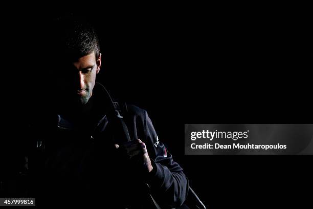 Novak Djokovic of Serbia walks out to play his match against Philipp Kohlschreiber of Germany during day 2 of the BNP Paribas Masters held at the at...