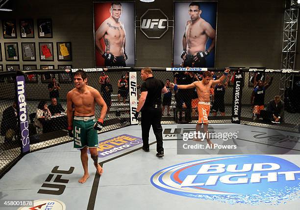 Team Werdum fighter Leonardo Morales raises his hand after his fight against team Velasquez fighter Gabriel Benitez in their semifinal fight during...