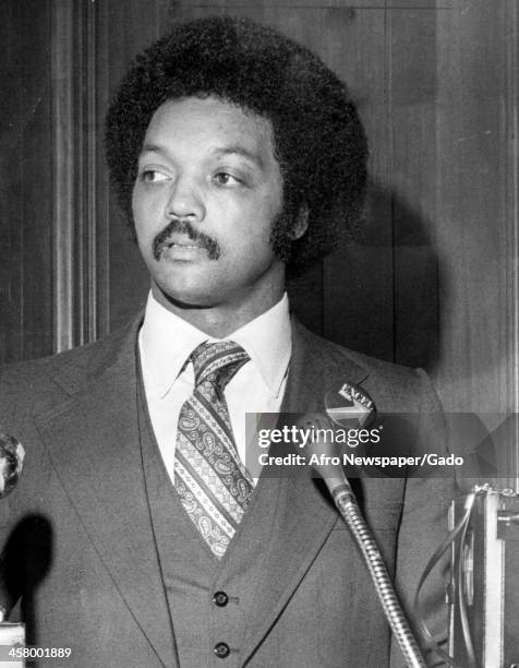 Jesse Jackson Sr as a young man with an Afro haircut delivers a speech, 1978.