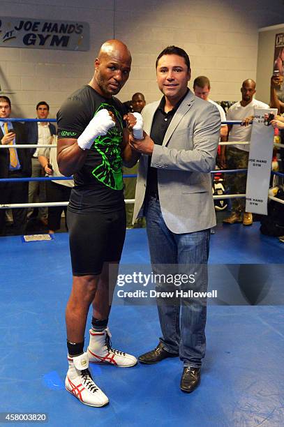 Bernard Hopkins and Oscar De LaHoya pose for a photograph at Joe Hand Boxing Gym on October 28, 2014 in Philadelphia, Pennsylvania.