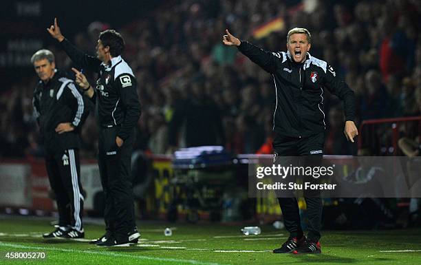 Bournemouth manager Eddie Howe urges his team on as Alan Irvine looks on during the Capital One Cup Fourth Round match between AFC Bournemouth and...