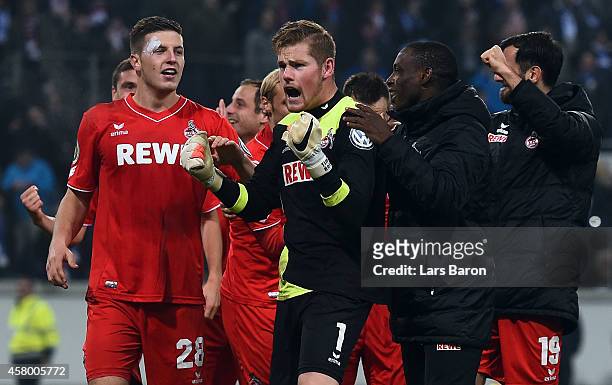 Timo Horn of Koeln celebrates with team mates after winning the DFB Cup second round match between MSV Duisburg and 1. FC Koeln at...
