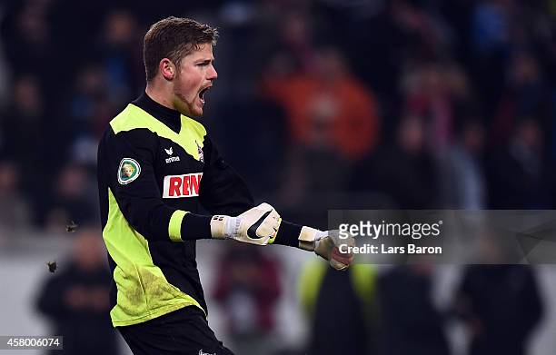 Timo Horn of Koeln celebrates with team mates after winning the DFB Cup second round match between MSV Duisburg and 1. FC Koeln at...