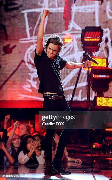 Harry Styles of 'One Direction' performs onstage on FOX's "The X Factor" Season 3 Live Finale on December 19, 2013 in Hollywood, California.