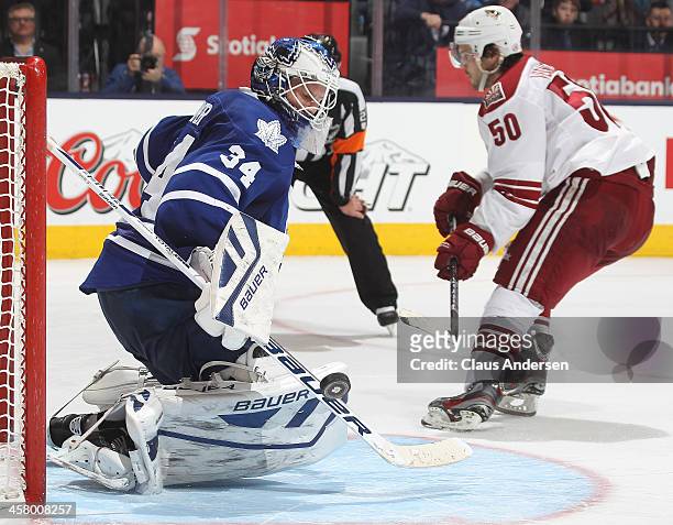 Antoine Vermette of the Phoenix Coyotes is stopped on the final attempt in the shoot-out by James Reimer of the Toronto Maple Leafs during an NHL...