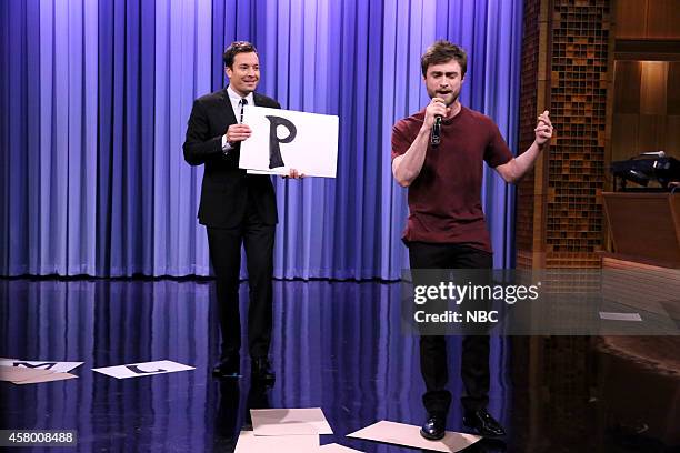 Episode 0150 -- Pictured: Host Jimmy Fallon watches as actor Daniel Radcliffe performs the "Alphabet Aerobics" rap by Blackalicious on October 28,...