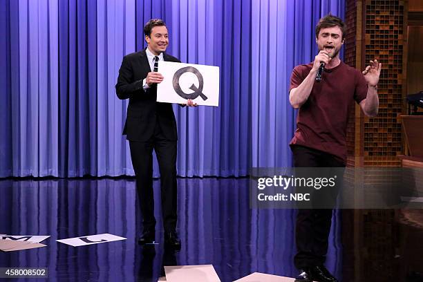 Episode 0150 -- Pictured: Host Jimmy Fallon watches as actor Daniel Radcliffe performs the "Alphabet Aerobics" rap by Blackalicious on October 28,...