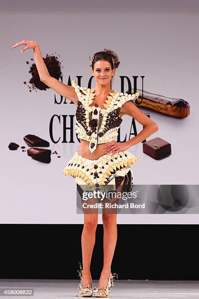 Nubia Esteban walks the runway and wears a chocolate dress made by designer Benjamin Bout and chocolate brand Chocolaterie de Puyricard during the...