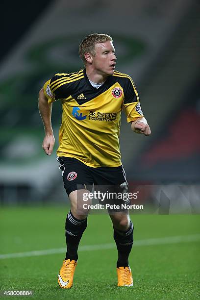 Craig Alcock of Sheffield United in action during the Capital One Cup Fourth Round match between MK Dons and Sheffield United at Stadium mk on...