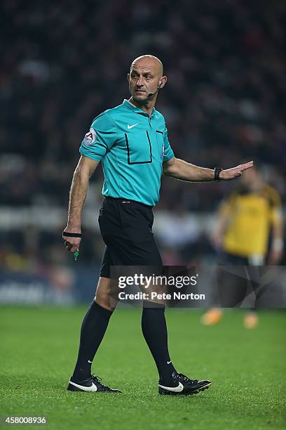 Referee Roger East in action during the Capital One Cup Fourth Round match between MK Dons and Sheffield United at Stadium mk on October 28, 2014 in...