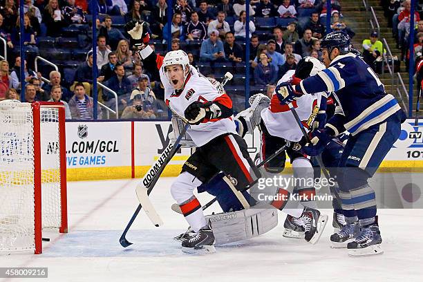 Kyle Turris of the Ottawa Senators celebrates after Clarke MacArthur of the Ottawa Senators redirected a shot past Curtis McElhinney of the Columbus...