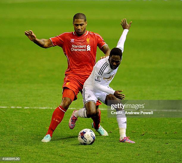 Glen Johnson of Liverpool competes with Nathan Dyer of Swansea City during the Capital One Cup Fourth Round match between Liverpool and Swansea City...