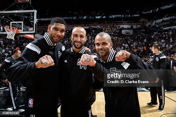 Tim Duncan Manu Ginobili and Tony Parker of the San Antonio Spurs receive Championship Rings prior to the game against the Dallas Mavericks at the...