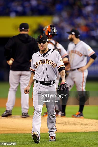 Jake Peavy of the San Francisco Giants walks to the dugout after getting pulled from the game in the second inning during Game Six of the 2014 World...