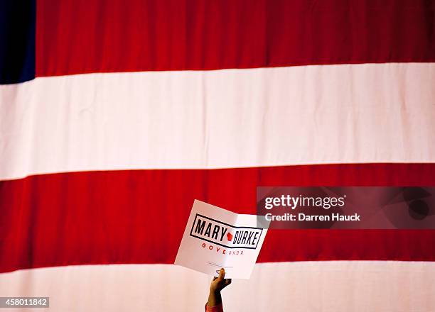 Supporter holds up a sign as U.S. President Barack Obama speaks at a campaign rally for Democratic challenger for Wisconsin Governor Mary Burke at...