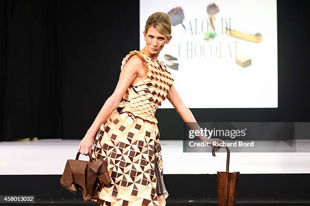 Helene Gateau walks the runway and wears a chocolate costume made by chocolate brand Chocolats Rozsavolgyi during the Fashion Chocolate show at Salon...