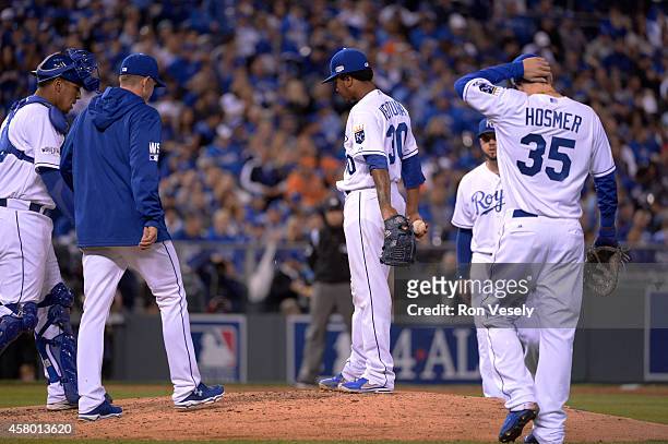 Dave Eiland of the Kansas City Royals visits Yordano Ventura during Game 6 of the 2014 World Series against the San Francisco Giants on Tuesday,...