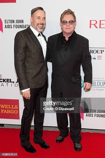 Elton John and David Furnish attend the Elton John AIDS Foundation's 13th Annual An Enduring Vision Benefit at Cipriani Wall Street on October 28,...