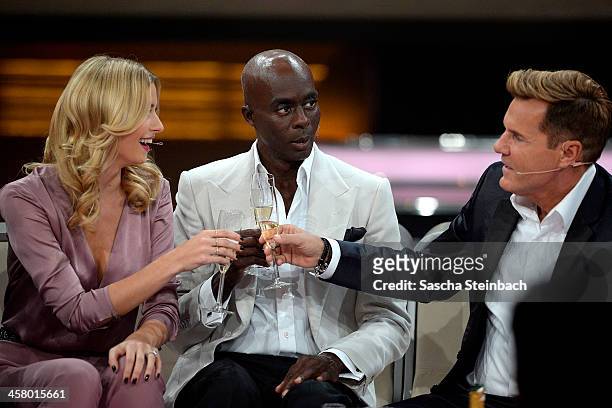 Lena Gercke, Bruce Darnell and Dieter Bohlen clink glasses during the taping of the anniversary show '30 Jahre RTL - Die grosse Jubilaeumsshow mit...