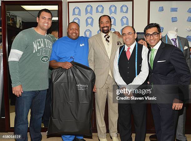 Former Jets player Anthony Becht, Doe Fund program member/recipient of a suit, former basketball player Walt "Clyde" Frasier, Mohan Ramchandani and...