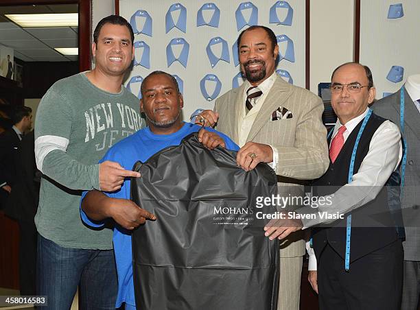 Former Jets player Anthony Becht, Doe Fund program member/recipient of a suit, former basketball player Walt "Clyde" Frasier and Mohan Ramchandani...