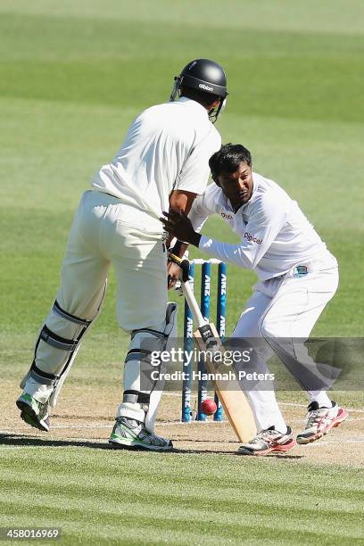 Veerasammy Permaul of the West Indies runs into Ross Taylor of New Zealand during day two of the Third Test match between New Zealand and the West...