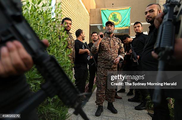 Logistics, Training and Development Chief, Haji Jaffer Al-Bindawi, speaks to his men the Imam Ali Brigade headquarters in Baghdad, Iraq, October 19,...