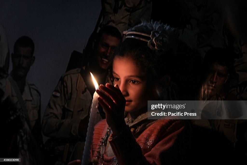 Palestinian children and families lit candles for the souls...