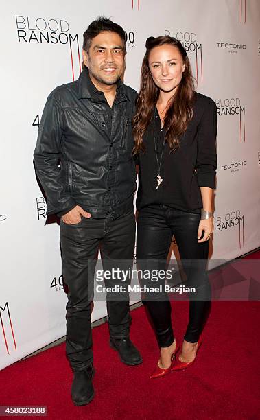 Director Francis dela Torre and actress Briana Evigan attend the Los Angeles Premiere Of "Blood Ransom" on October 28, 2014 in Los Angeles,...