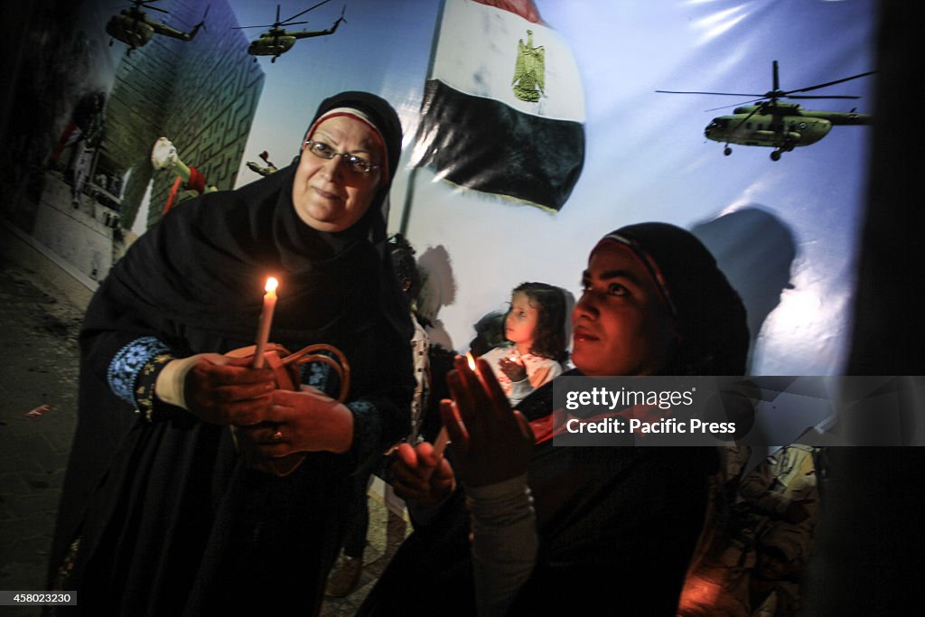 Palestinian children and families lit candles for the souls...