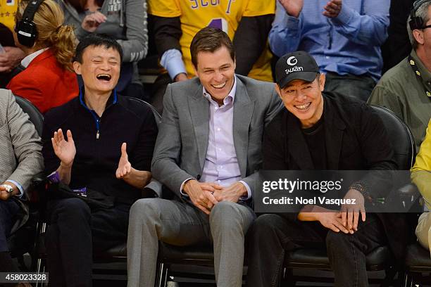 Jack Ma, Patrick Whitesell and Jet Li attends a basketball game between the Houston Rockets and the Los Angeles Lakers at Staples Center on October...