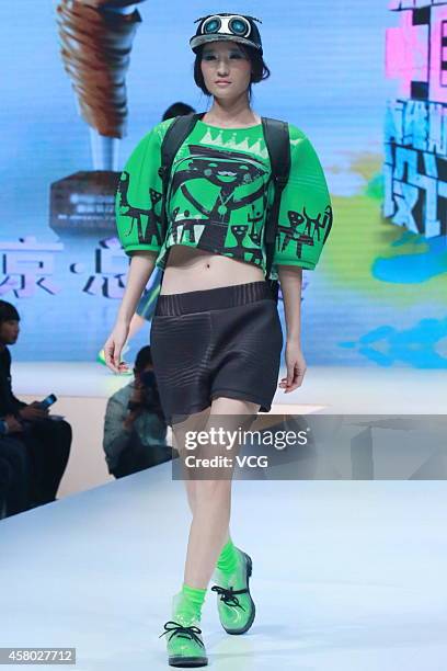 Model showcases designs on the runway at JEANSWEST Cup 23rd China Casual Wear Design Contest Final show during the fourth day of the Mercedes-Benz...
