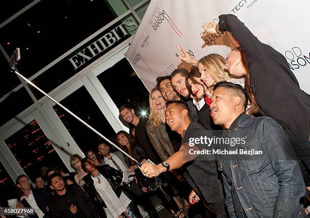 Publicist Rembrandt Flores takes a selfie with actress Kristin Bauer van Straten, director Francis dela Torre, actor Alexander Dreymon and actresses...