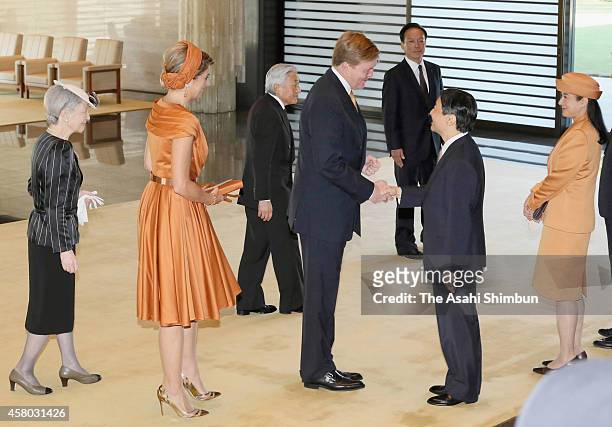 King Willem-Alexander of the Netherlands shakes hands with Crown Prince Naruhito while Queen Maxima of the Netherlands , Emperor Akihito , Empress...