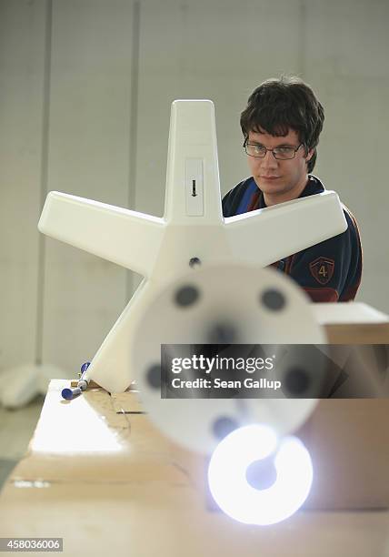 Kai Rietentiet, a worker at the workshops for the handicapped of the German Red Cross , assembles a lamp at the workshop facility in Nuthetal on...