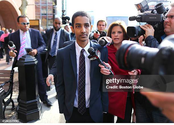 Robel Phillipos, friend of the Boston Marathon bomber, walks from the Moakley Federal Court in Boston to a waiting car after receiving a guilty...