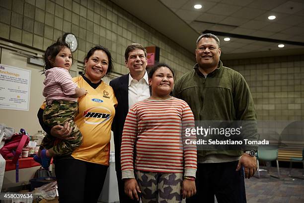 Democrate Senate candidate Mark Begich, poses for a portrait with supporters at an Anchorage town hall on October 16, 2014. Mark Begich is the junior...