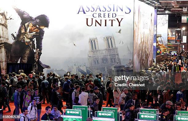 Poster of the video game 'Assassins creed Unity' is displayed during the International Games Week on October 29, 2014 in Paris, France. International...