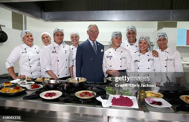 Prince Charles, Prince of Wales meets chefs during a visit to a 'Skill School' on October 29, 2014 in Bogota, Colombia. The Royal Couple are on a...