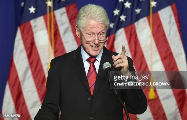 Former US President Bill Clinton gestures while speaking in show of support of California Democrats during during a "Get Out The Vote" rally in...