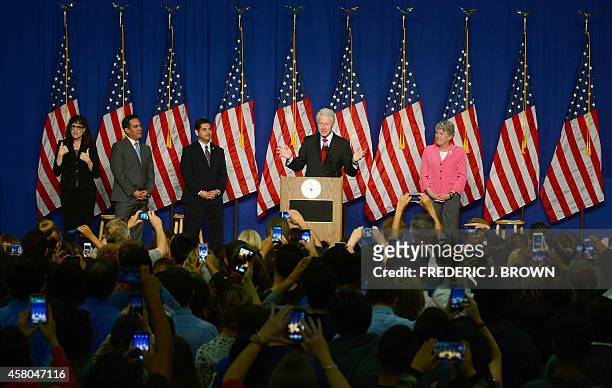 Former US President Bill Clinton gestures while speaking in show of support of California Democrats during during a "Get Out The Vote" rally in...