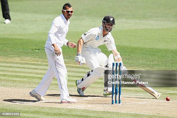 Sunil Narine of the West Indies fields as Kane Williamson runs home during day two of the Third Test match between New Zealand and the West Indies at...