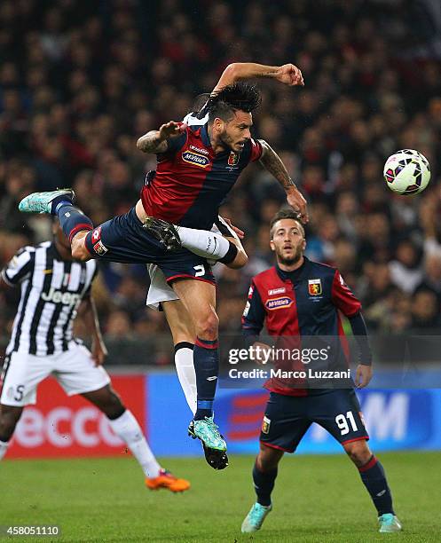 Mauricio Pinilla of Genoa CFC is challenged by Leonardo Bonucci of Juventus FC during the Serie A match between Genoa CFC and Juventus FC at Stadio...