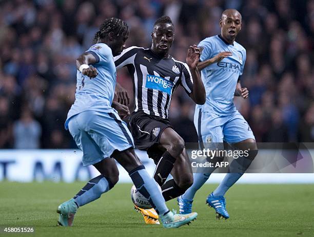 Newcastle United's French defender Massadio Haidara is challenged for the ball by Manchester City's French defender Bacary Sagna and Manchester...